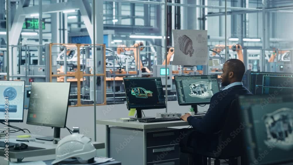 Poster Car Factory Office: Black Engineer Working on Desktop Computer, Screens Show CAD Software with 3D Turbine Engine, Electric Car. Automated Robot Arm Assembly Line Manufacturing High-Tech Vehicles