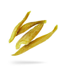 Dried candied rhubarb in the air on a white background