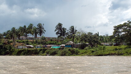 Obraz premium Houses in a village along the river near Playa del Oro, Ecuador