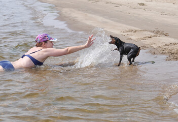 child playing with dog