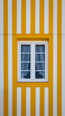 Detail of an exterior window in traditional houses on the beach at Costa Nova, Ilhavo, Aveiro, Portugal.