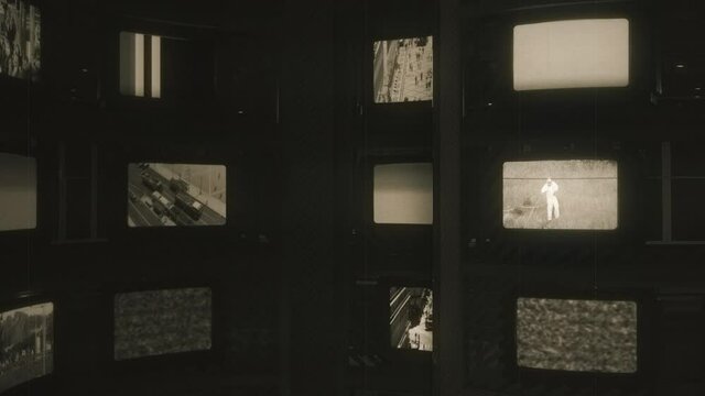 Old Televisions Wall Film Roll Effect, Retro Technology TV. Spinning televisions film roll with movies and static noise interference. Motion background