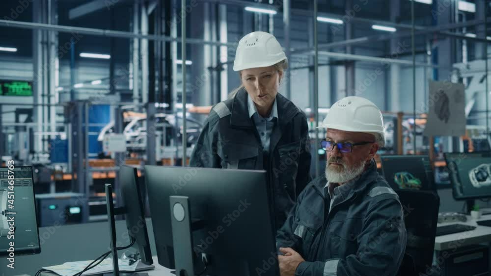 Poster car factory office: female manager talks to male automotive engineer working on computer. automated 