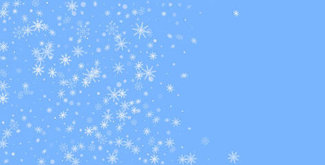 White delicate openwork snowflakes are scattered on a blue background. Festive background, postcard design, wallpaper