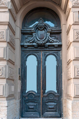 wooden door with a beautiful decorative finish in the historical part of the Russian city of St. Petersburg