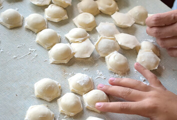 cooking homemade dumplings in the kitchen, close-up