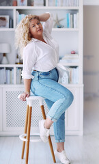 attractive plus size woman wearing high waist jeans and knotted shirt