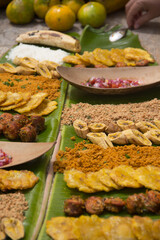 Ecuadorian food: Picada manabita (Longaniza, roast manuro, patacones, cheese, salad, salprieta and broken peanuts)