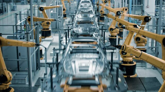 Car Factory 3D Concept: Automated Robot Arm Assembly Line Manufacturing High-Tech Green Energy Electric Vehicles. Automatic Construction, Welding Industrial Production Conveyor. Front View Time-Lapse
