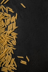 Types of pasta on a black background