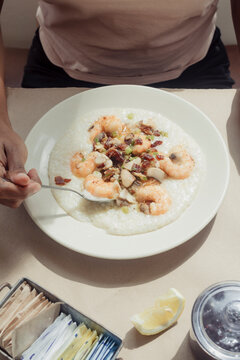 A bowl of shrimp and grits inside of a restaurant