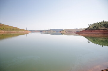 Fototapeta na wymiar View of the dam in low water level water crisis. 