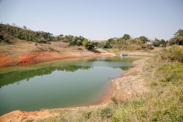 View of the dam in low water level water crisis.
