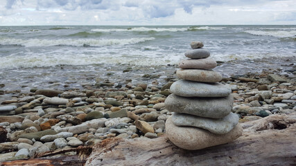 memorial cairn stones on the beach