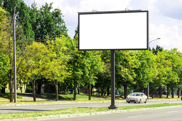 blank advertising billboard mockup. urban life. near park area. template for design. large advertising road banner