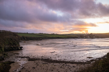 Pastel-colored beach at sunset