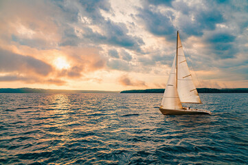 Sailing yacht in a calm sea and an incredible sunset.