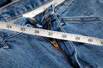 Pants and waist measurement tape. Diet, weight loss and gain concept