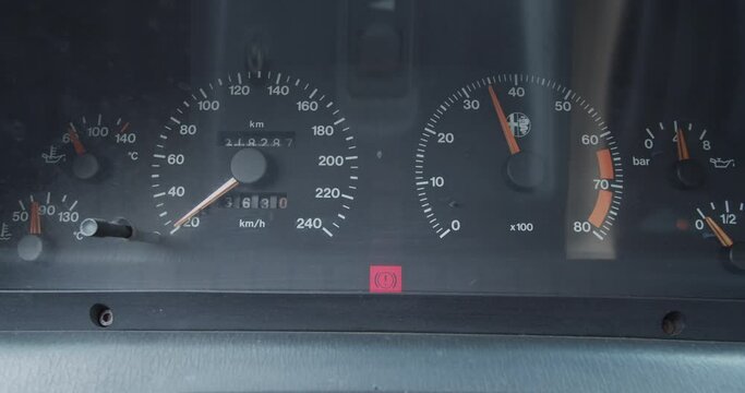 Car dashboard while engine accelerates
