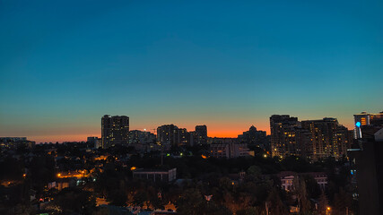 Odessa landscape at sunset. Night city lights. Blue and orange.