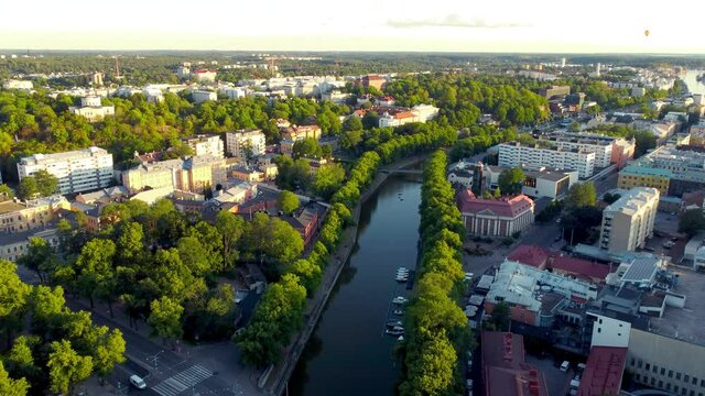 Fly over Aurajoki river in city center of Turku, Finland.