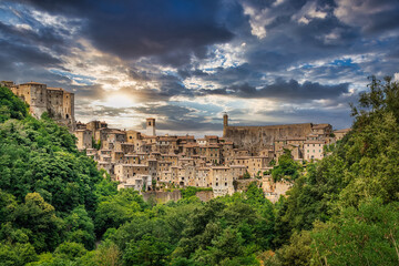 Fototapeta na wymiar View from above on the medieval town of Sorano at sunset, in the Province of Grosseto, Tuscany (Toscana), Italy