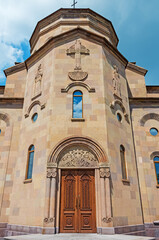 Fototapeta premium Facade wall and central entrance doors to church