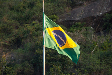 brazil flag outdoors on top of a building in Rio de Janeiro.
