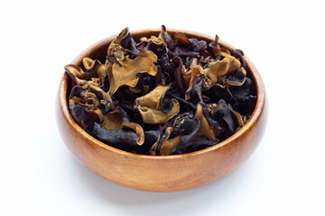 Fototapeta na wymiar Dried black fungus in wooden bowl on white background.
