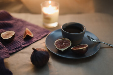cozy composition with ripe fresh figs and textiles 