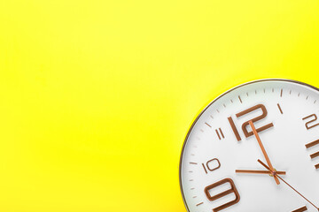 Stylish clock on color background