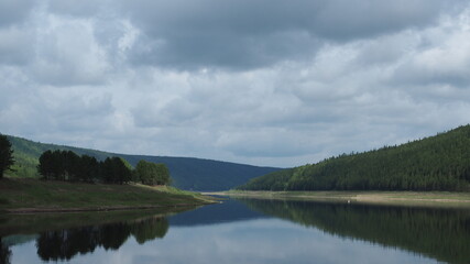 Perspective view of large Lena river. Orkutsk oblast, Siberia, Russia. Siberian taiga forest and hills at background.