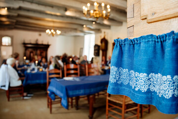 Beautiful blue embroidery with blurry background. Celebration in a historical location. Tea Museum...