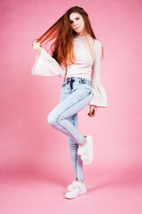 cute pretty red hair teenage girl on pink background, lifestyle modern people concept