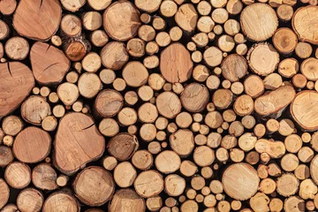Möbelaufkleber Pile stacked of natural sawn wooden logs background © LRafael