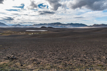 Hverir, a geothermal spot with bubbling pools of mud and steaming fumaroles in Iceland