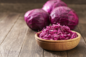 Fresh red cabbage or purple cabbage or blaukraut on a wooden table with copy space for text.