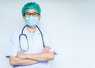 Confident healthcare worker standing and crossed her arms before working in hospital isolated on white background.