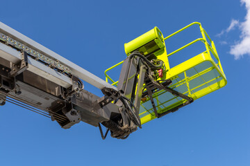 New lifting cradle against the blue sky. Construction and repair equipment for work at height