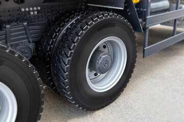 Obraz na płótnie Canvas The rear wheels of a clean truck with new tires. Radial tubeless tires