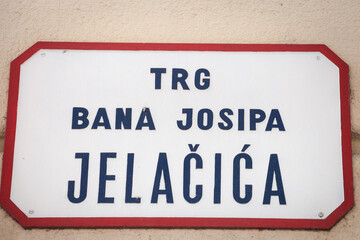 Street sign of Trg Bana Josipa Jelacica, meaning Ban Jelacic Square in Croatian language. an Jelacic square is the main square of downtown Zagreb and a major landmark.......