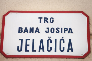 Obraz premium Street sign of Trg Bana Josipa Jelacica, meaning Ban Jelacic Square in Croatian language. an Jelacic square is the main square of downtown Zagreb and a major landmark.......