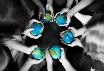 Kids holding the world in their hands