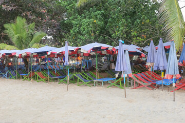 The beach in Thailand with the beach chair and umbrella for tourist in Rayong province, but no tourists, Thailand.