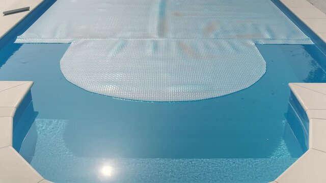 Bubble wrap for pool. Swimming pool protection concept at home
