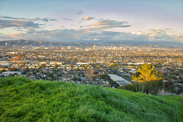 early morning veiw of a city skyline from high up on an overlook
