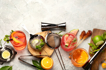 Cocktails assortment served on light background.