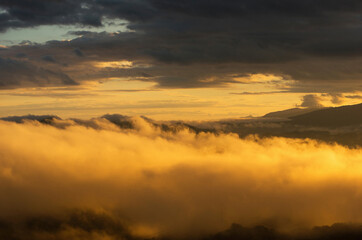 Naklejka na ściany i meble Aerial view Beautiful of morning scenery Golden light sunrise And the mist flows on high mountains, Wonder fog.