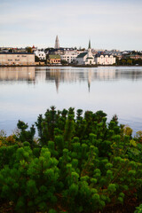 A partial view of downtown Reykjavík, capital city of Iceland, from the banks of Tjörnin lake - obrazy, fototapety, plakaty