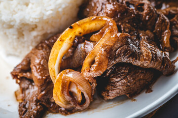 Bistek Tagalog( Filipino Beef Steak) is made of thinly sliced sirloin braised in a mixture of citrus, soy sauce, onions, and garlic.

